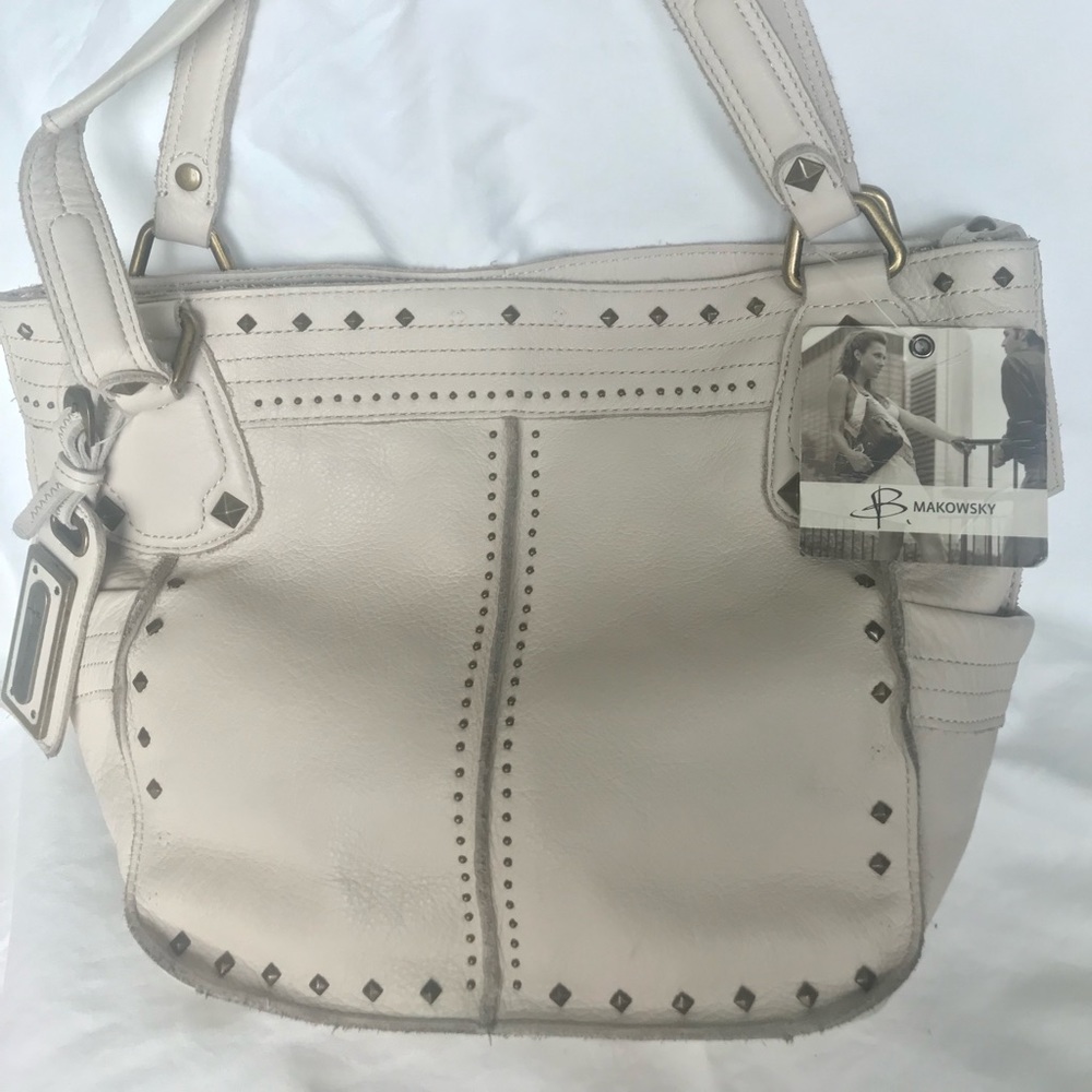 New quality leather Makowsky tote. Bag is missing a few small metal accents.